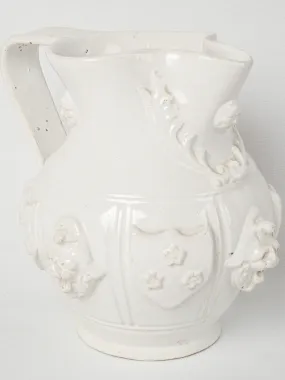 Large Émile Tessier pitcher w/ masks & coat of arms 9"