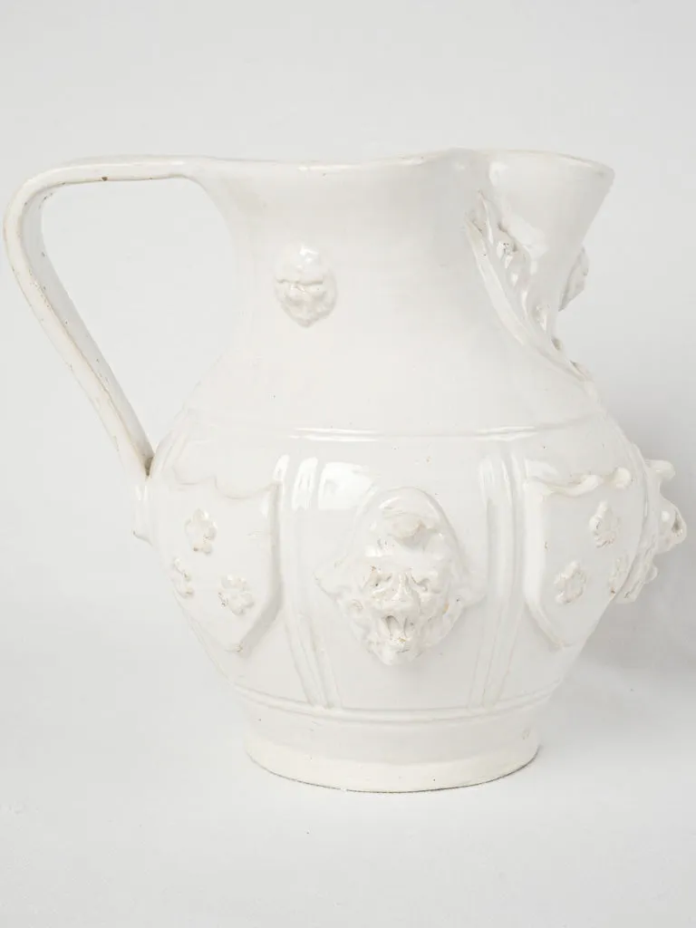 Large Émile Tessier pitcher w/ masks & coat of arms 9"